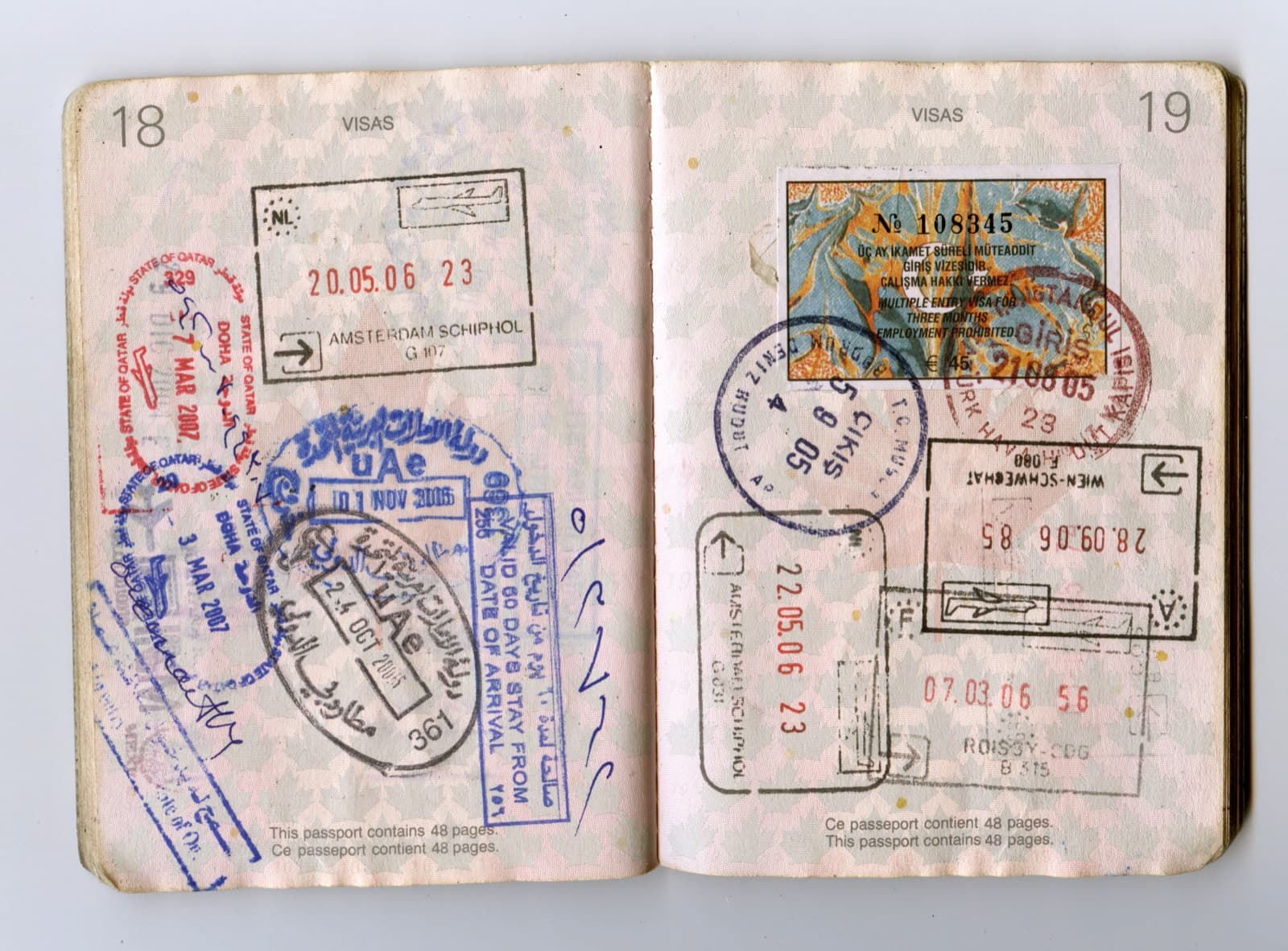 A passport spread showing visas and entry stamps